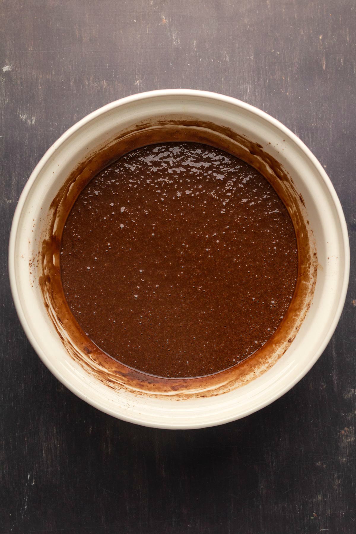 Batter for chocolate cake in a mixing bowl.