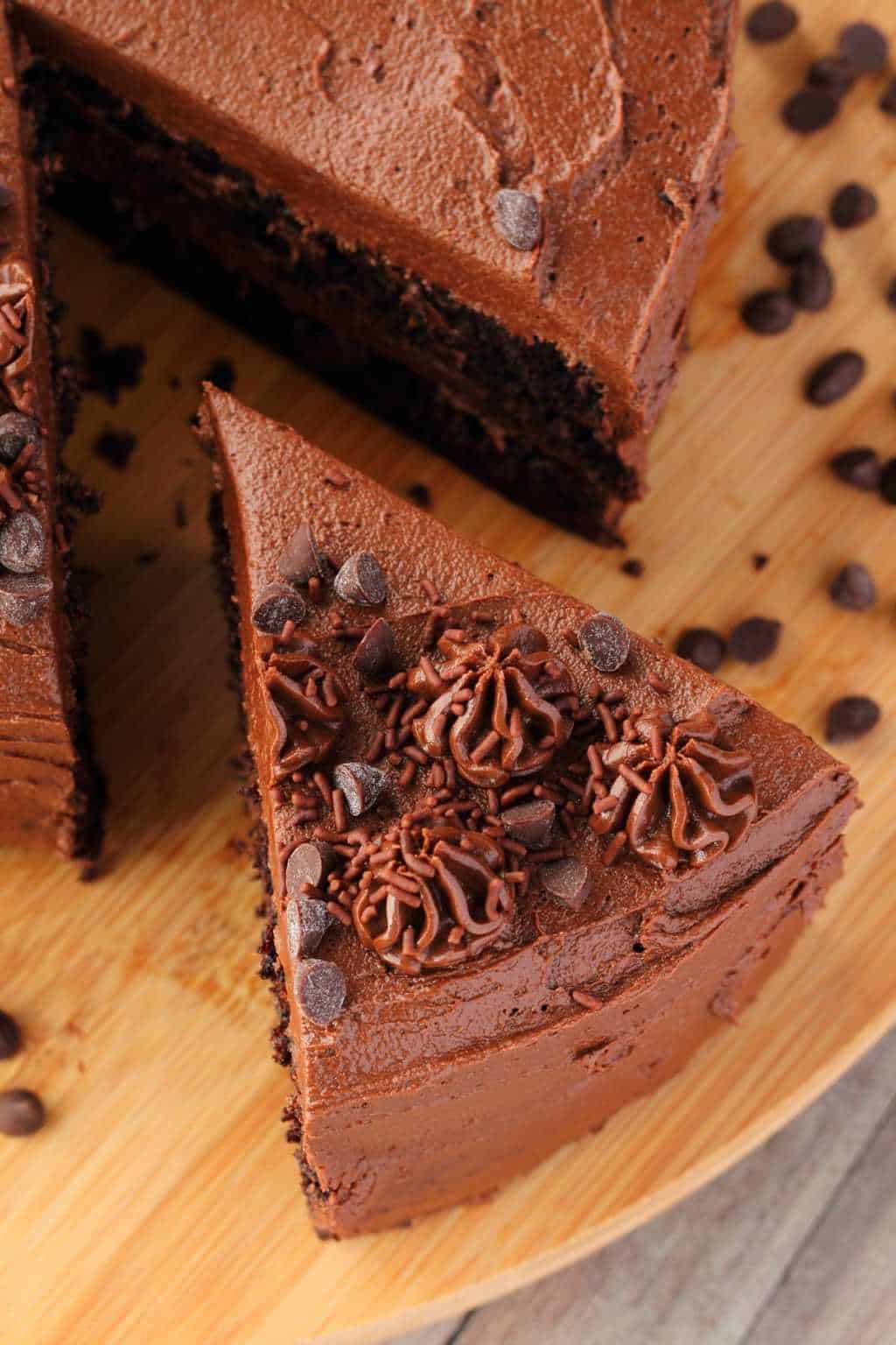 Vegan chocolate zucchini cake with one slice cut and ready to be served. 