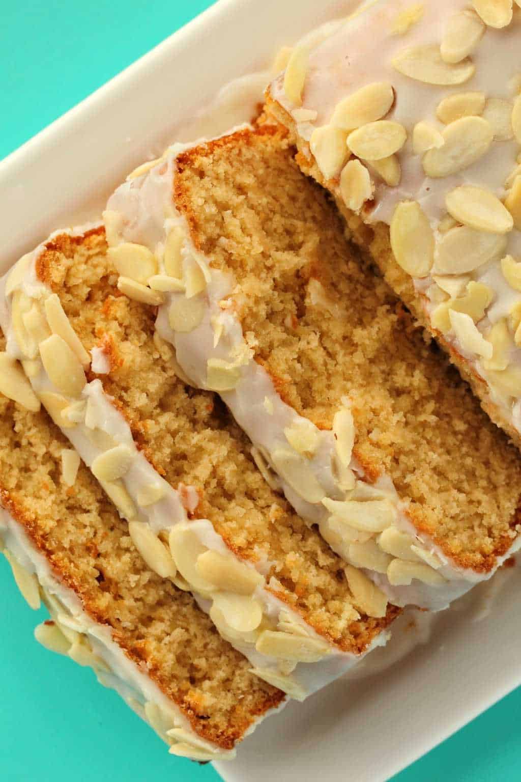 Vegan Pound Cake freshly sliced, on a white plate. 