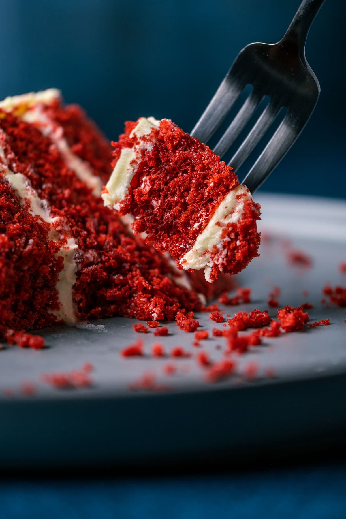 Forkful of vegan red velvet cake.